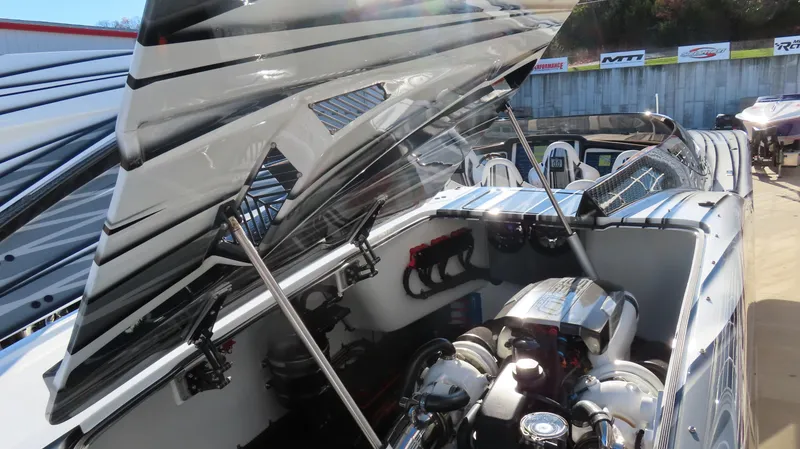 Slide: The Image of 2020 MTI 48 boat engine compartment with open hatch, showcasing powerful engine components. - 39