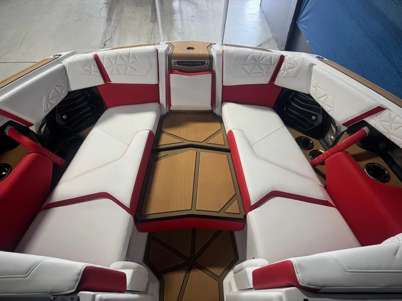 Slide: The Image of 2025 Nautique Super Air Nautique G23 Paragon interior with red and white seating. - 16