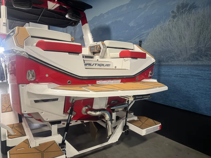 Slide: The Image of 2025 Nautique Super Air Nautique G23 Paragon boat, rear view, red and white design. - 5
