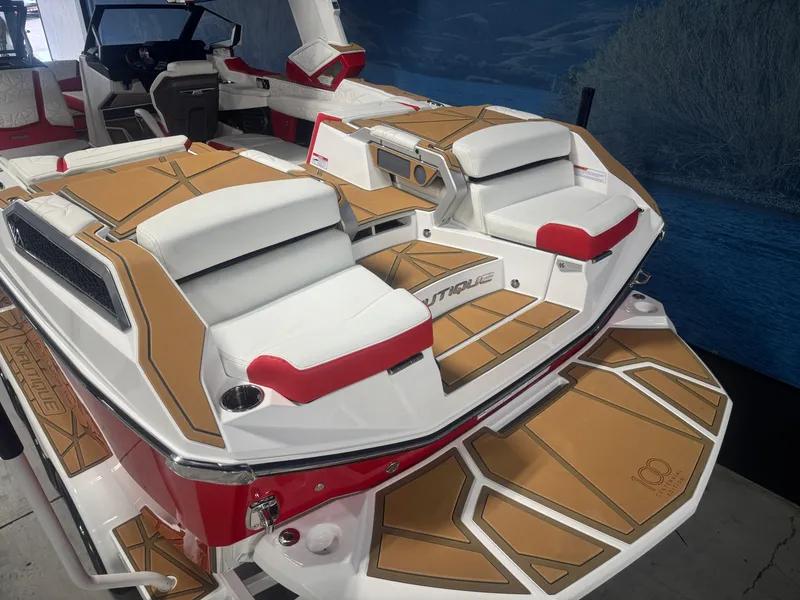 Slide: The Image of 2025 Nautique Super Air Nautique G23 Paragon boat interior with luxurious seating and deck design. - 7