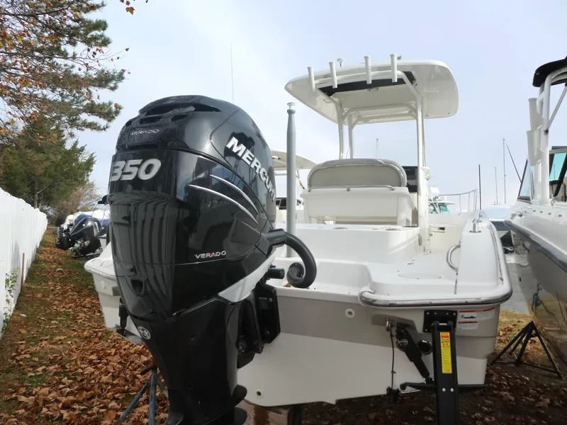 Slide: The Image of 2019 Boston Whaler 270 Dauntless with Mercury 350 Verado engine, docked outdoors. - 12