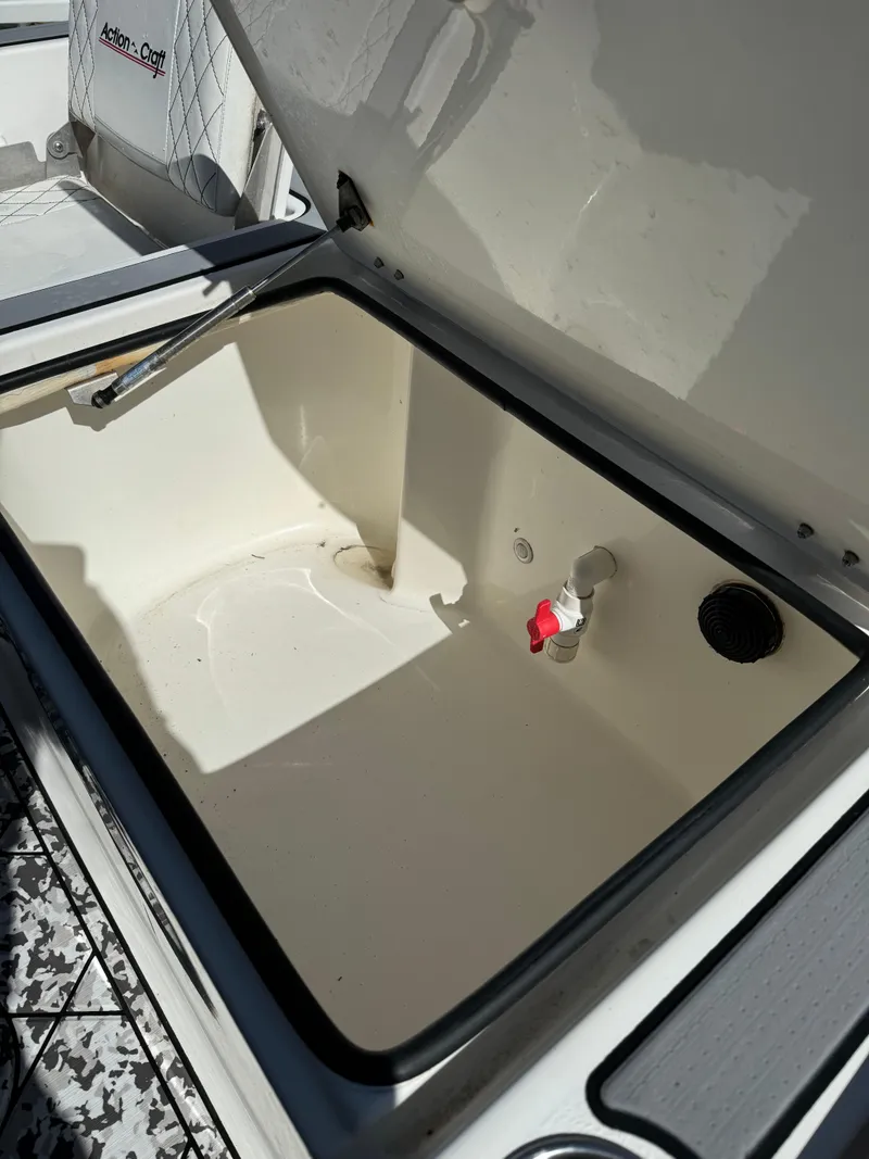 Slide: The Image of Open storage compartment on 2017 Action Craft 24 A.C.E. boat. - 41