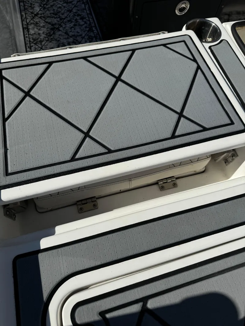 Slide: The Image of 2017 Action Craft 24 A.C.E. boat deck with non-slip surface and storage compartment. - 43