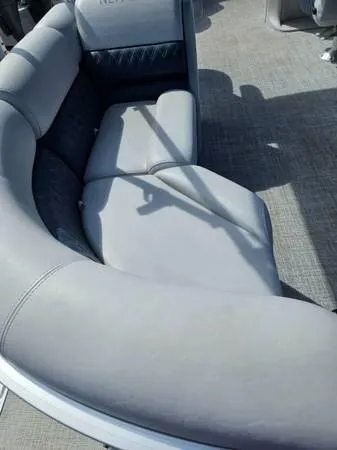 Slide: The Image of 2022 Nepallo 20QL boat interior with gray cushioned seating. - 10