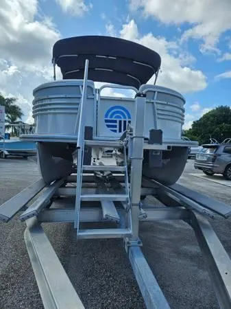Slide: The Image of 2022 Nepallo 20QL pontoon boat on trailer under a cloudy sky. - 12