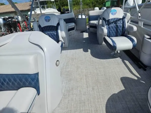 Slide: The Image of 2022 Nepallo 20QL pontoon boat interior with plush seating and modern design. - 2
