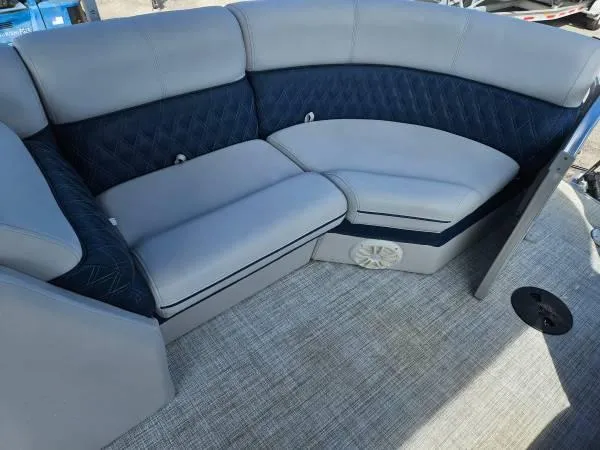 Slide: The Image of Luxurious seating area in 2022 Nepallo 20QL boat with gray and navy upholstery. - 8