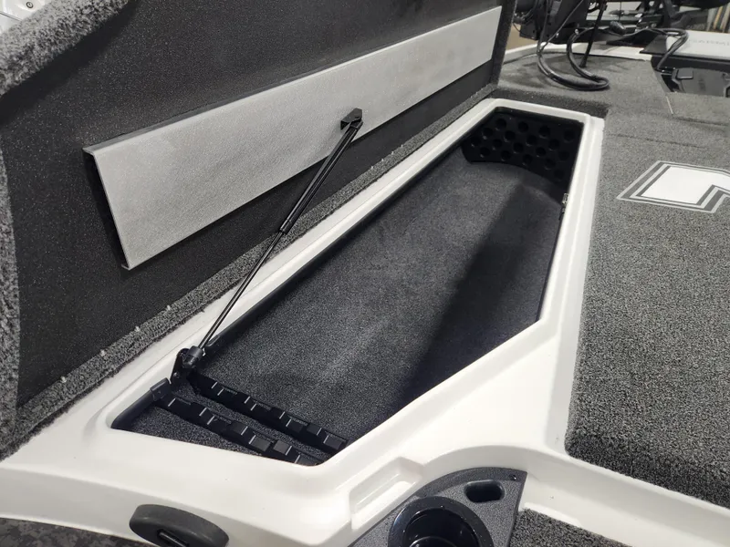 Slide: The Image of 2025 Nitro Z20 XL Pro boat storage compartment with open lid and organized interior. - 14