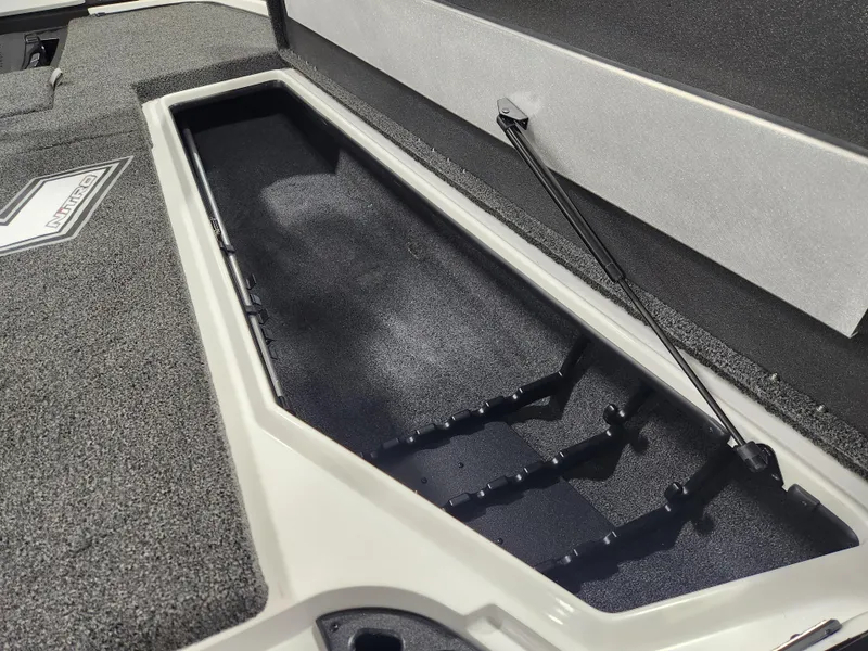 Slide: The Image of 2025 Nitro Z20 XL Pro boat storage compartment with rod holders. - 15