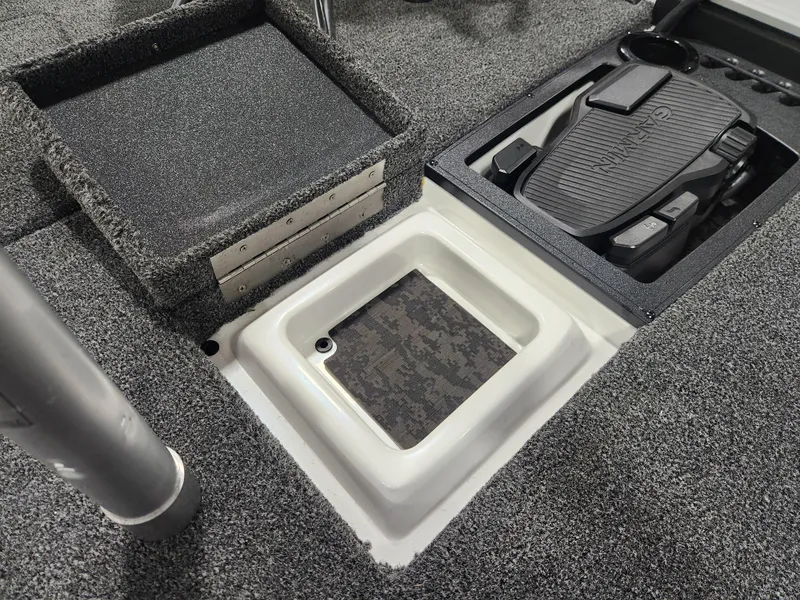 Slide: The Image of 2025 Nitro Z20 XL Pro boat interior with pedal and storage compartments. - 19