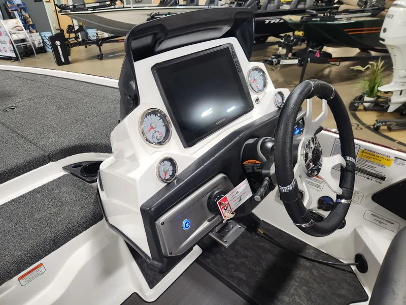 Slide: The Image of 2025 Nitro Z20 XL Pro boat dashboard with steering wheel and digital display. - 25