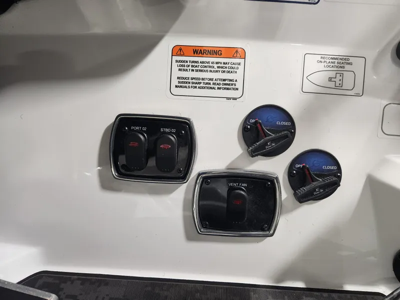 Slide: The Image of Control panel of 2025 Nitro Z20 XL Pro boat with warning label and switches. - 28