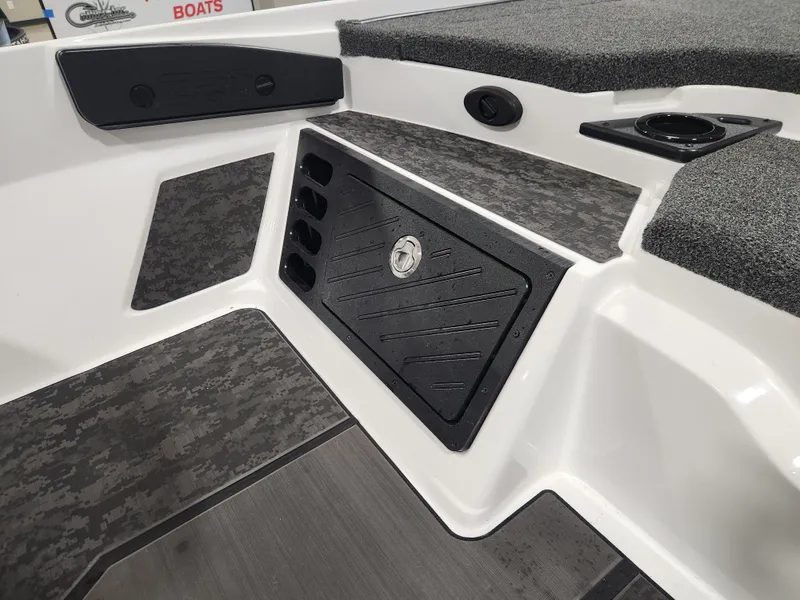 Slide: The Image of 2025 Nitro Z20 XL Pro boat interior with storage compartment and cup holder. - 29