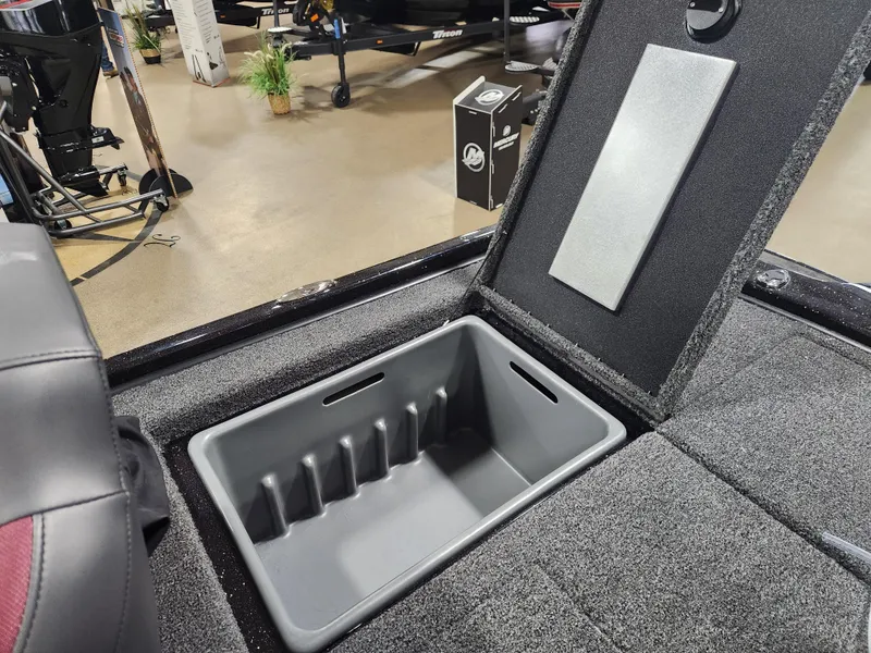 Slide: The Image of 2025 Nitro Z20 XL Pro boat storage compartment with open lid, showcasing interior space. - 32