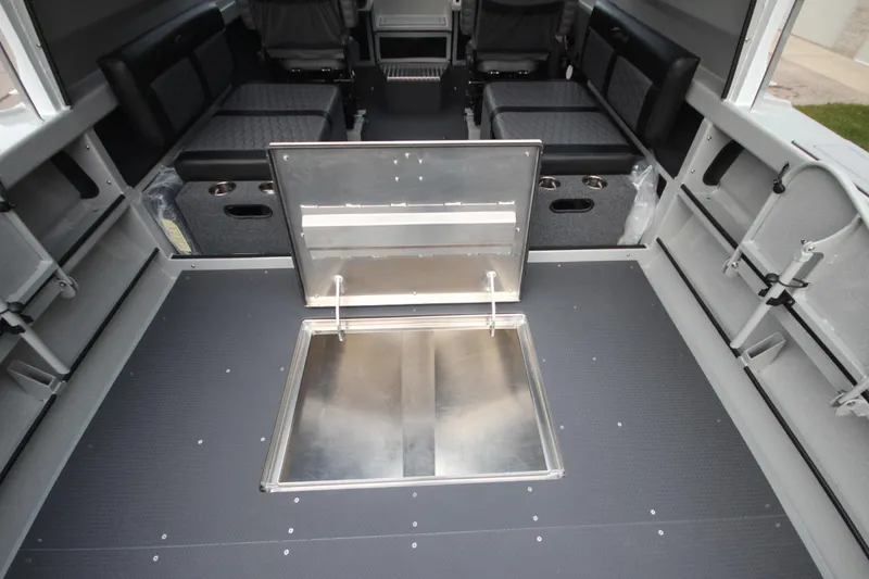 Slide: The Image of Interior of 2025 Weldcraft 240 Ocean King boat with open hatch and seating. - 13