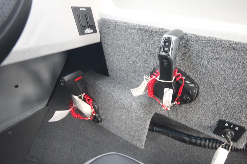 Slide: The Image of Interior controls of 2025 Weldcraft 240 Ocean King F300XCB boat. - 23