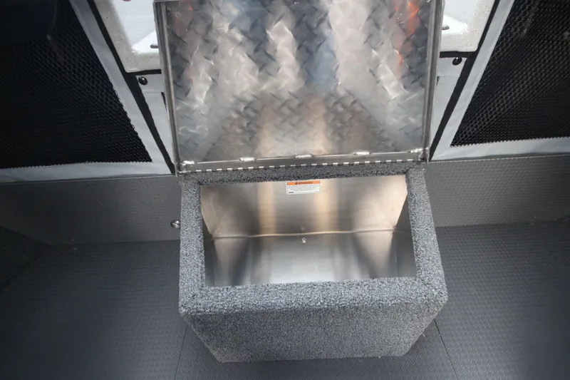 Slide: The Image of 2025 Weldcraft 240 Ocean King F300XCB storage compartment with open lid, showcasing interior space. - 27