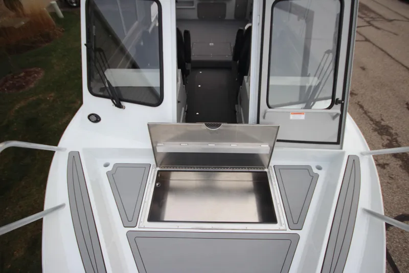 Slide: The Image of 2025 Weldcraft 240 Ocean King F300XCB boat deck with open storage compartment. - 33