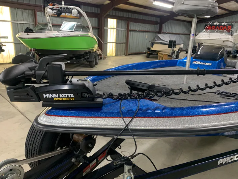 Slide: The Image of 1998 ProCraft 200 Bass boat with Minn Kota PowerDrive trolling motor in a storage facility. - 8