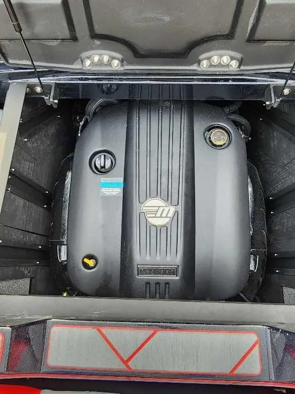 Slide: The Image of 2025 Malibu Wakesetter 23 LSV engine compartment, showcasing powerful inboard motor. - 13