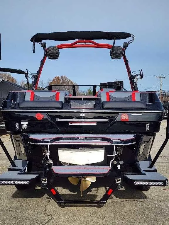 Slide: The Image of 2025 Malibu Wakesetter 23 LSV boat, rear view, featuring sleek design and modern wakeboarding features. - 14