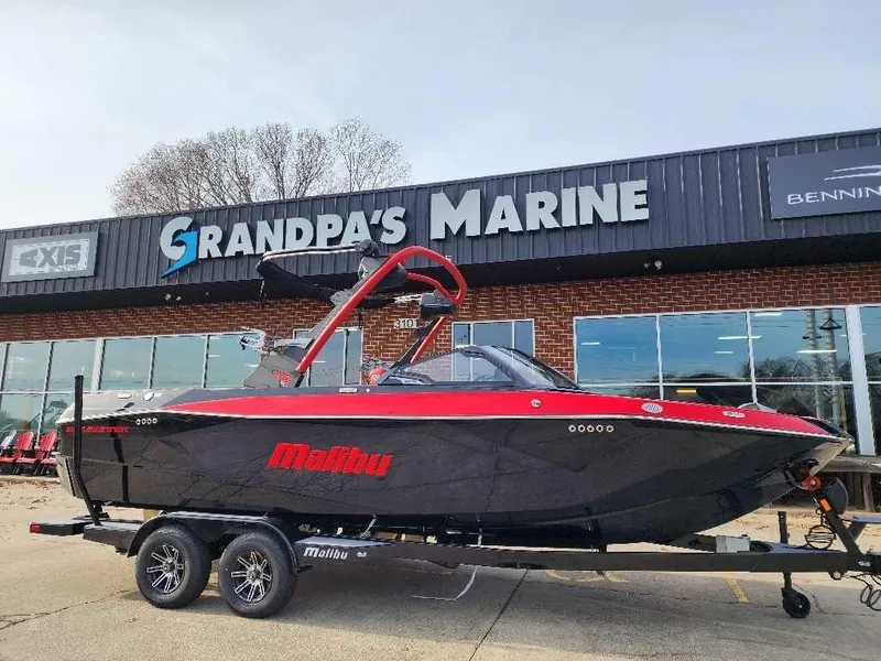 Slide: The Image of 2025 Malibu Wakesetter 23 LSV boat on trailer at Grandpa's Marine dealership. - 16