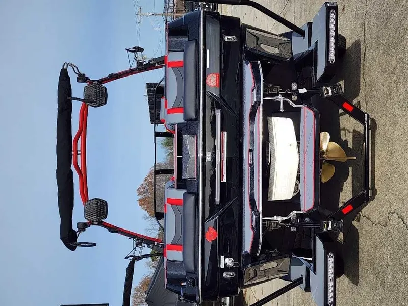Slide: The Image of 2025 Malibu Wakesetter 23 LSV boat, rear view, showcasing sleek design and features. - 6
