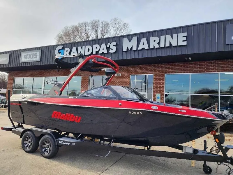 Slide: The Image of 2025 Malibu Wakesetter 23 LSV boat on trailer at Grandpa's Marine dealership. - 7