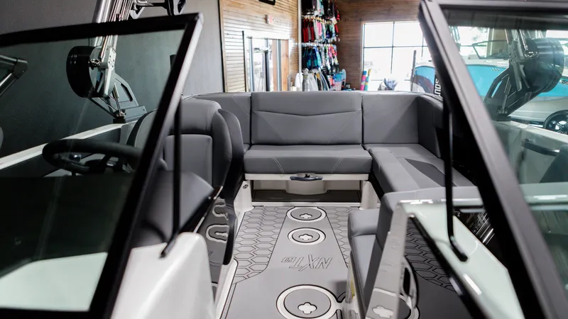 Slide: The Image of 2024 MasterCraft NXT20 boat interior with gray seating and modern design. - 3