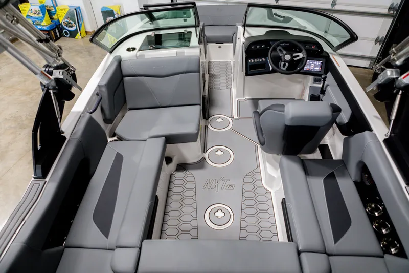 Slide: The Image of 2024 MasterCraft NXT20 boat interior with gray seating and modern dashboard. - 6