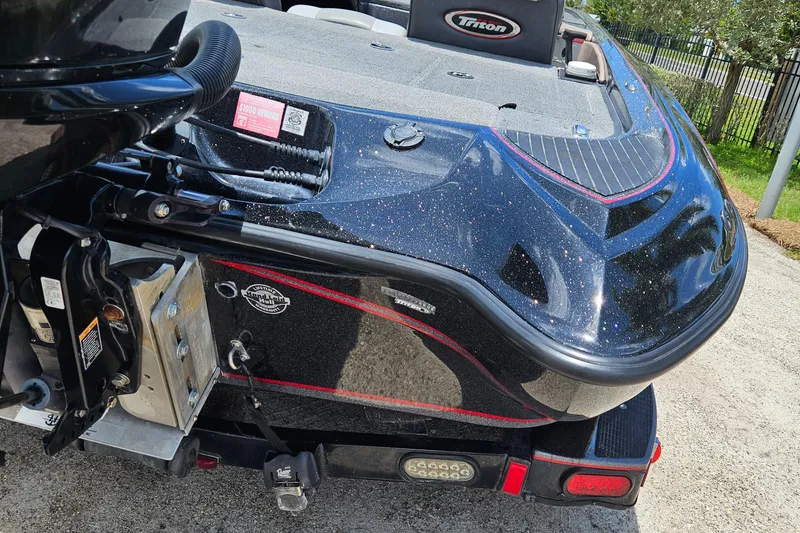 Slide: The Image of 2006 Triton Tr-21X HP boat with MotorGuide trolling motor on deck. - 12
