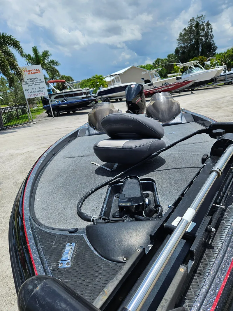 Slide: The Image of 2006 Triton Tr-21X HP boat trailer with black frame and silver accents. - 14