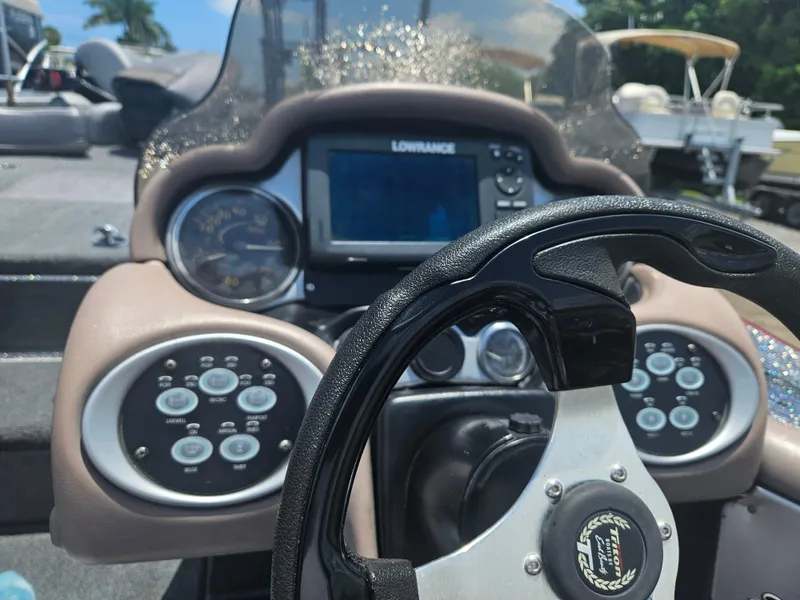 Slide: The Image of Open storage compartments on a 2006 Triton Tr-21X HP boat. - 16