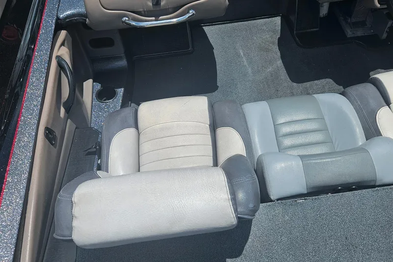 Slide: The Image of Open storage compartment in 2006 Triton Tr-21X HP boat. - 18