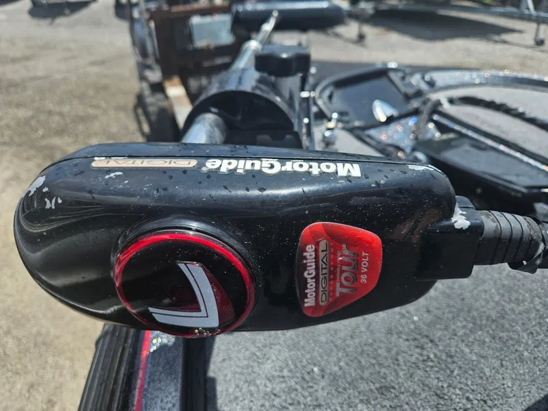 Slide: The Image of Open storage compartment in 2006 Triton Tr-21X HP boat, showing interior details. - 20