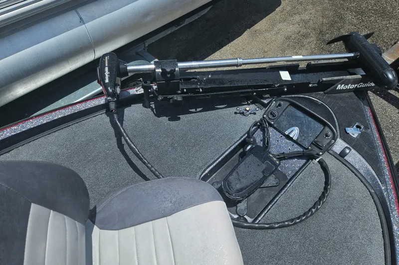 Slide: The Image of 2006 Triton Tr-21X HP boat storage compartment with cables and connectors. - 21