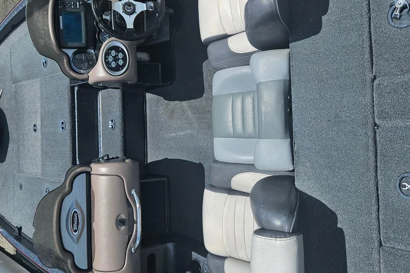 Slide: The Image of Open storage compartment in 2006 Triton Tr-21X HP boat, showing interior details. - 22