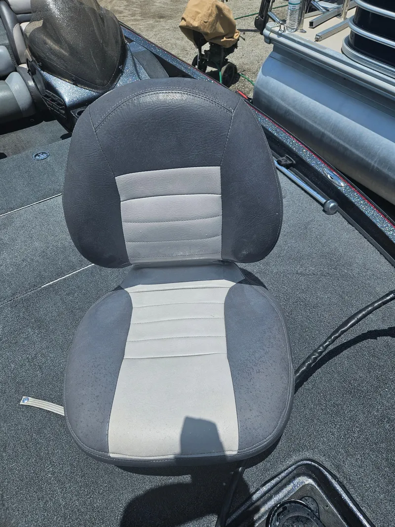 Slide: The Image of 2006 Triton Tr-21X HP boat interior with carpeted deck and visible wiring. - 24