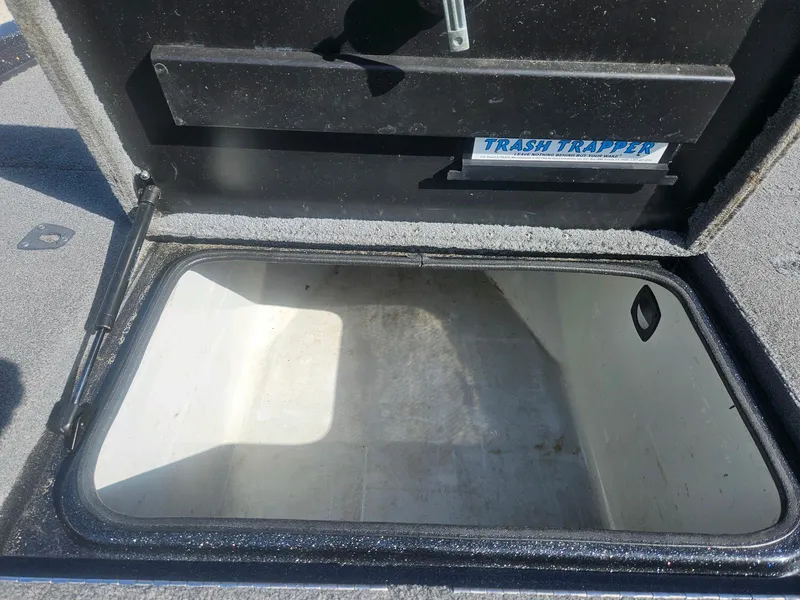 Slide: The Image of Open storage compartment in a 2006 Triton Tr-21X HP boat. - 27