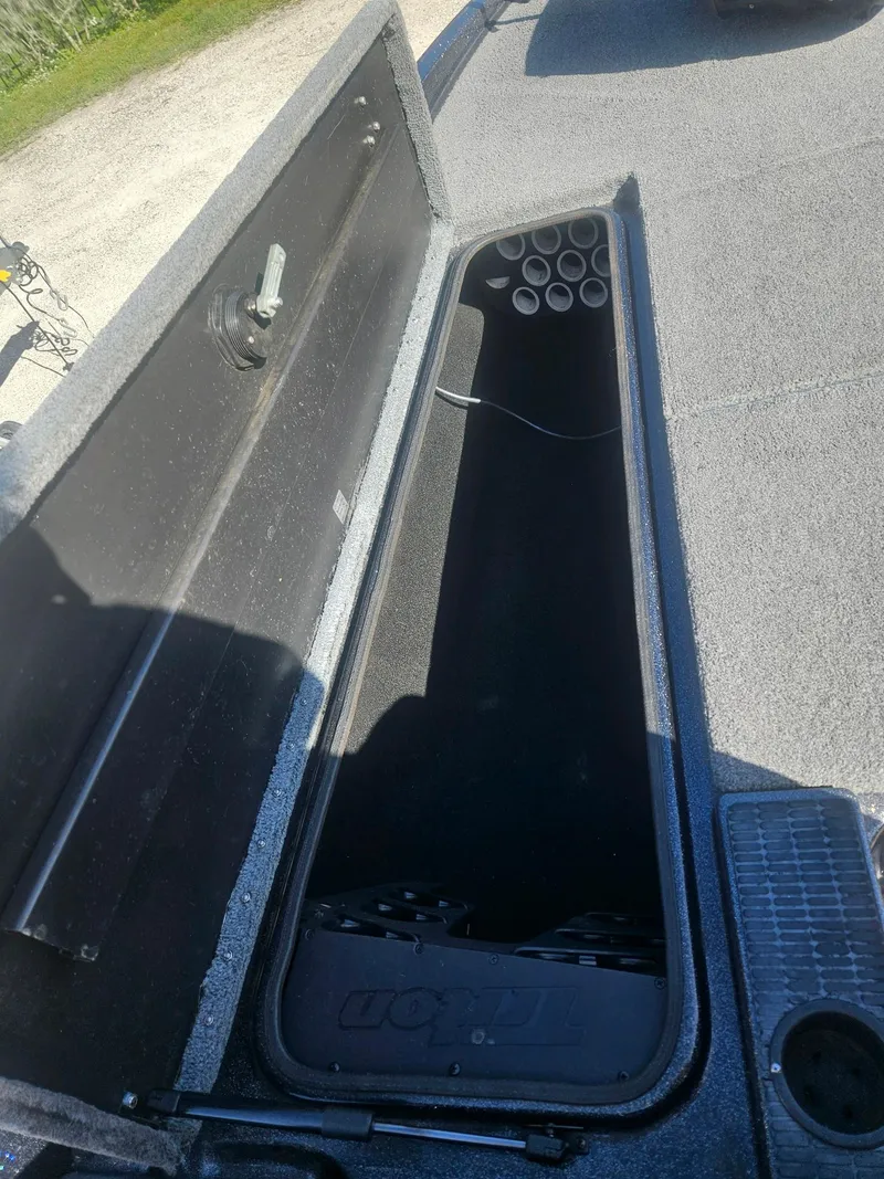 Slide: The Image of Open storage compartment in a 2006 Triton Tr-21X HP boat. - 28