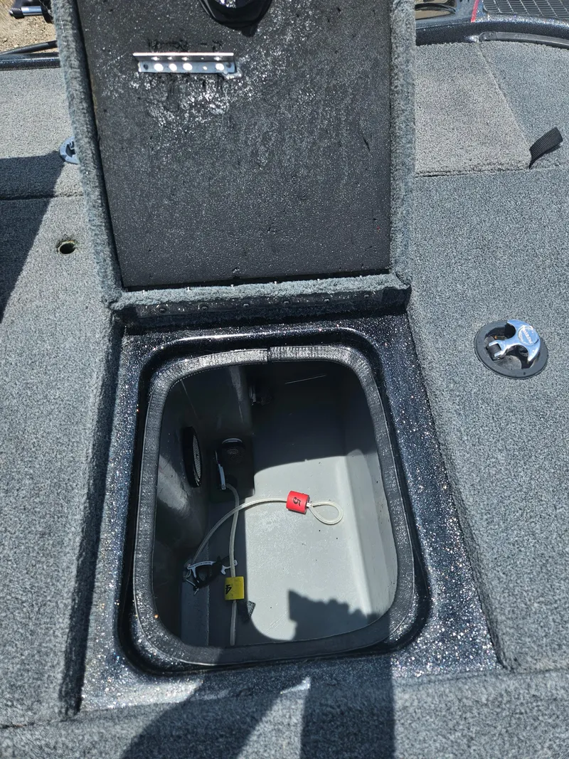 Slide: The Image of Open storage compartment in a 2006 Triton Tr-21X HP boat. - 31