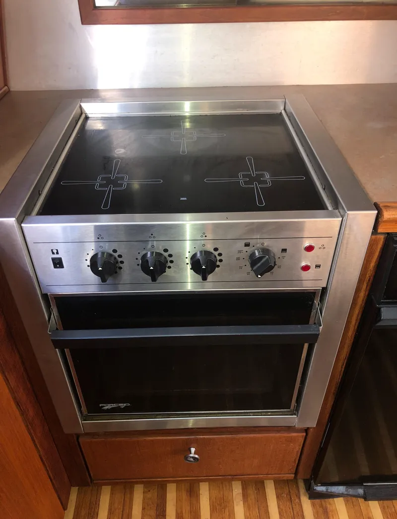 Slide: The Image of Stainless steel stove in 1996 Bayliner 4788 Pilot House Motoryacht kitchen. - 10