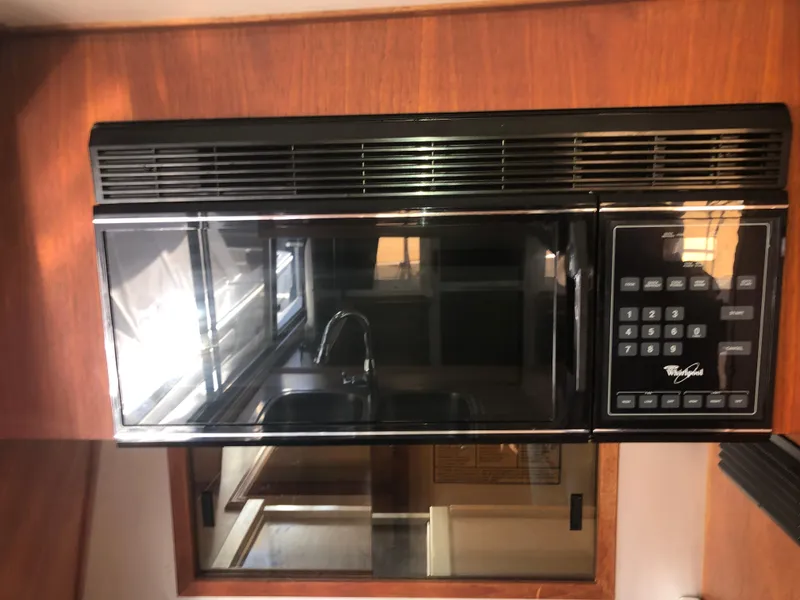 Slide: The Image of Microwave in 1996 Bayliner 4788 Pilot House Motoryacht kitchen area. - 12