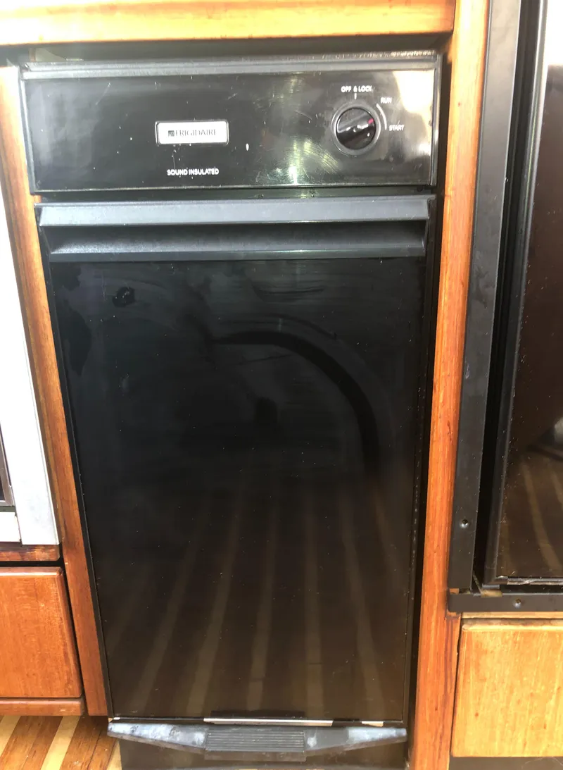 Slide: The Image of Black dishwasher in 1996 Bayliner 4788 Pilot House Motoryacht kitchen. - 13