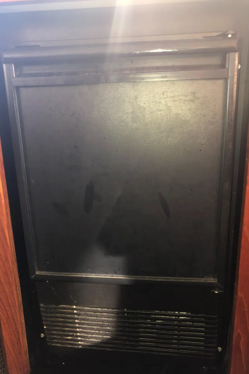 Slide: The Image of Black refrigerator door inside 1996 Bayliner 4788 Pilot House Motoryacht. - 14