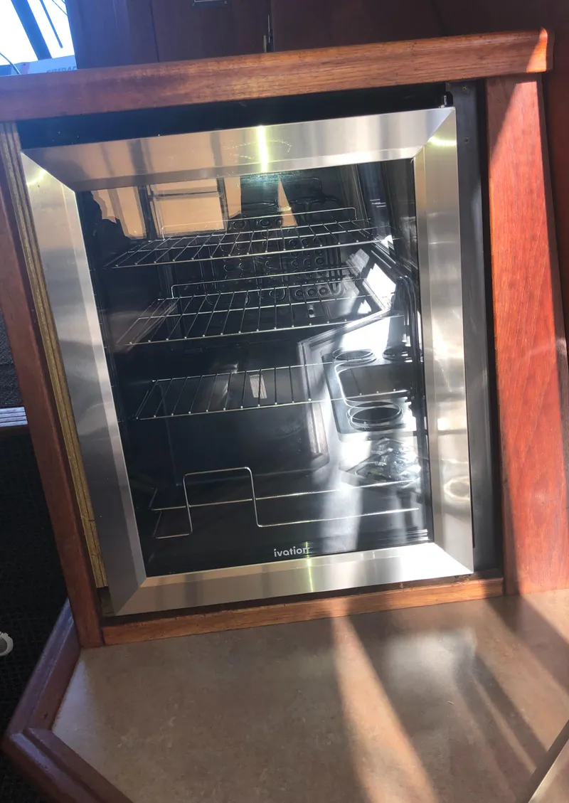 Slide: The Image of Stainless steel mini fridge inside 1996 Bayliner 4788 Pilot House Motoryacht. - 15