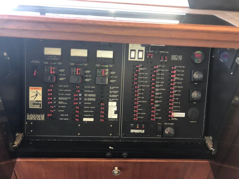 Slide: The Image of Electrical panel of 1996 Bayliner 4788 Pilot House Motoryacht with switches and gauges. - 22