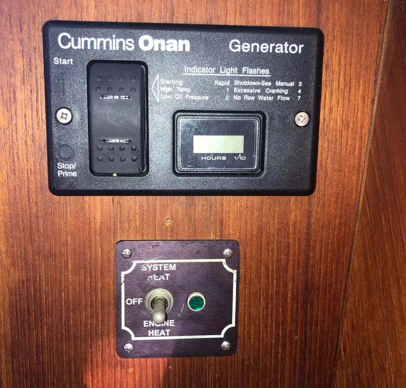 Slide: The Image of Control panel of a Cummins Onan generator on a 1996 Bayliner 4788 yacht. - 23
