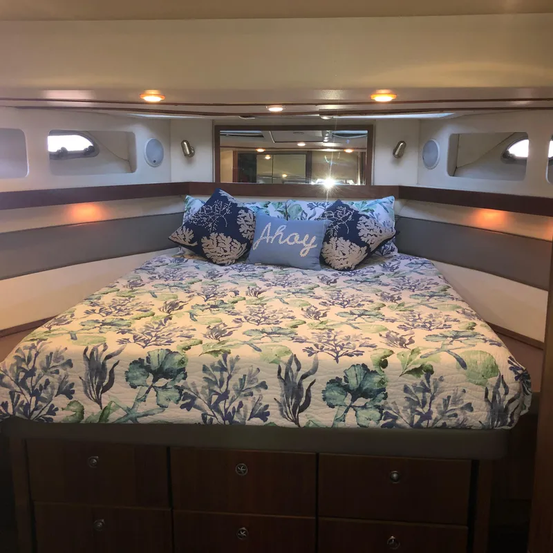Slide: The Image of Cozy bedroom in 1996 Bayliner 4788 Pilot House Motoryacht with nautical decor. - 27