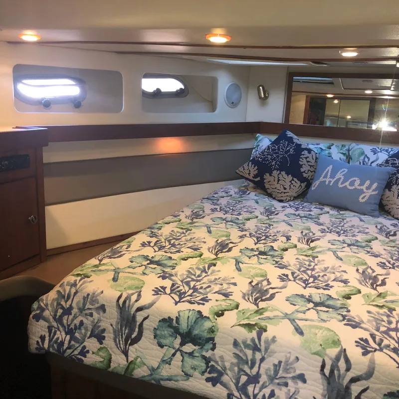 Slide: The Image of Cozy bedroom in 1996 Bayliner 4788 Pilot House Motoryacht with nautical decor. - 28